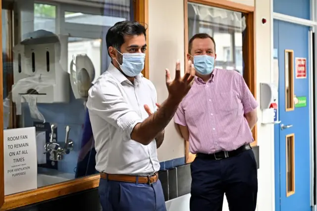 Health Secretary Humza Yousaf Scottish and Clinical Director Jason Leitch (right) during a visit to ICU and the infectious diseases unit at Monklands Hospital, in Airdrie, North Lanarkshire