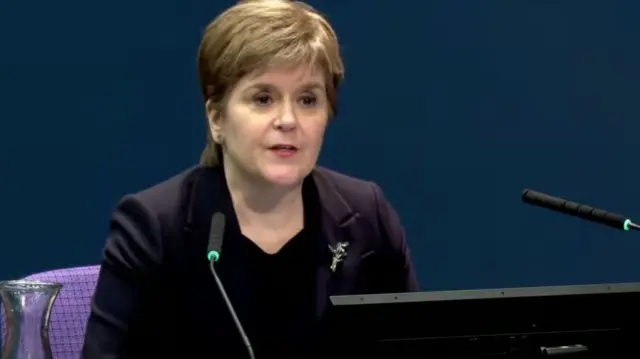 Nicola Sturgeon, wearing a blazer, gives evidence