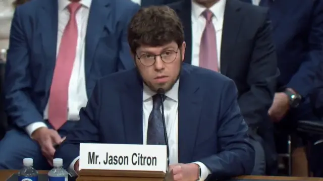 Citron speaks at the hearing