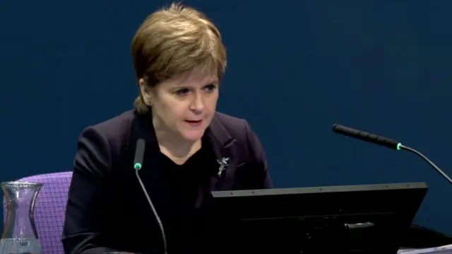 Nicola Sturgeon, wearing a blazer, gives evidence at the inquiry