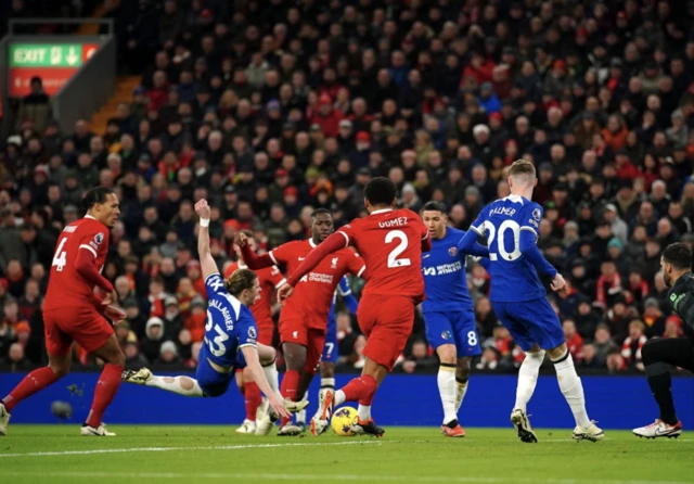 Chelsea's Conor Gallagher goes down under a challenge from Liverpool's Virgil van Dijk