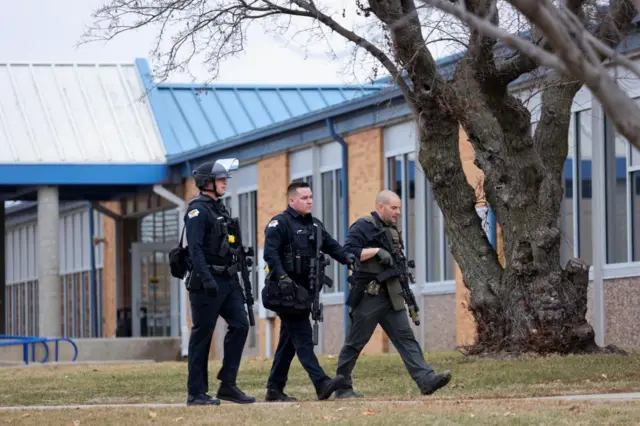 Armed police officers outside Perry High School