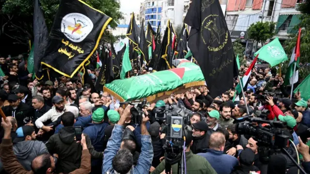 People carry the coffin of Hamas deputy chief Saleh al-Arouri