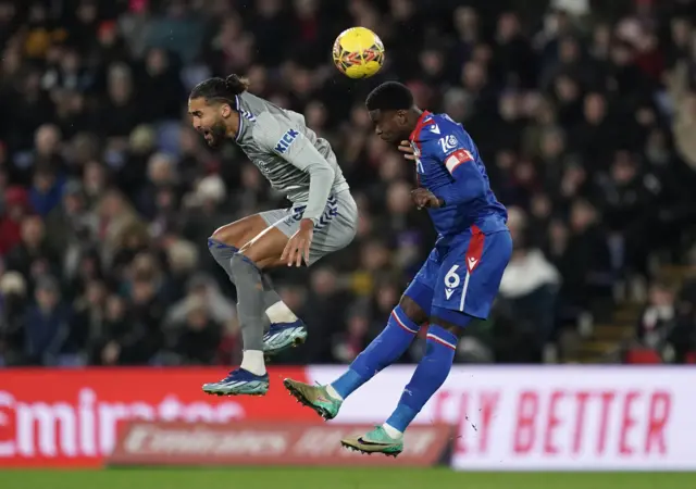 Guehi and Calvert Lewin jump for an aerial duel.
