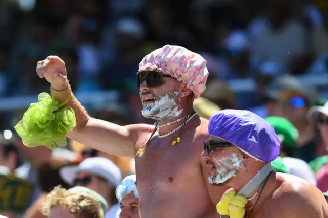 Supporters cheer from the stands during the second day of the second cricket Test match between South Africa and India at Newlands stadium in Cape Town on January 4, 2024.