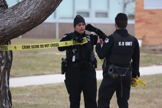 Police putting up crime scene tape