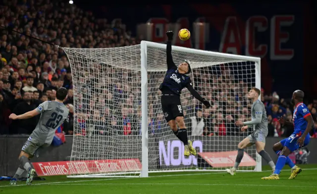 A cross chips Virginia in the Everton net.