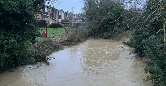 A nearby stream that caused the flood