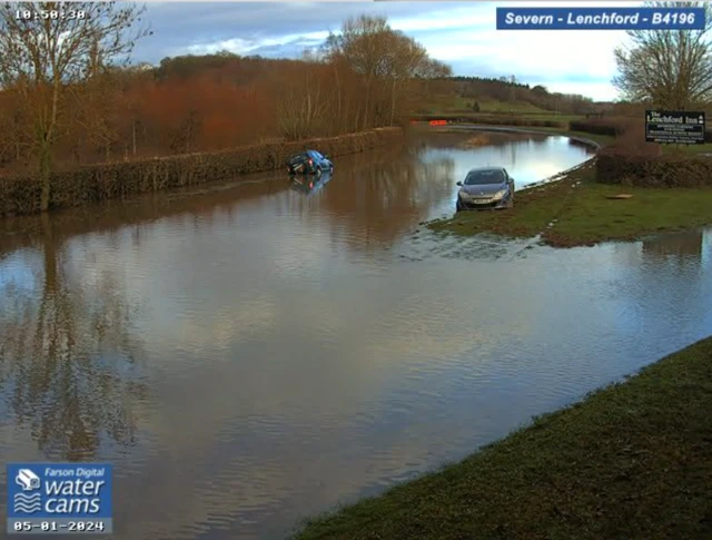 Flooded road by the Lenchford Inn