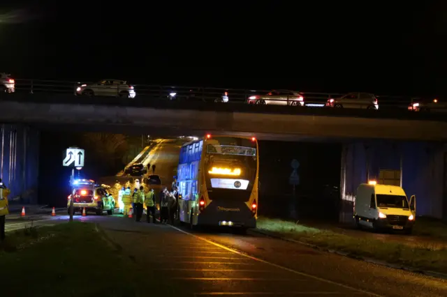 Cars stranded in flood water under the M27