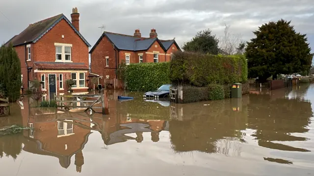 Flooded street in Longford, Gloucestershire