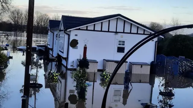 A house surrounded by water