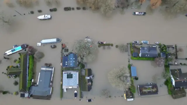 An aerial view shows properties surrounded by floodwater, in the aftermath of Storm Henk, on an island in the River Thames at Henley-on-Thames, Britain, January 5,