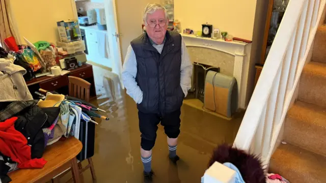 Rodney Mosley in his flooded Gloucestershire home