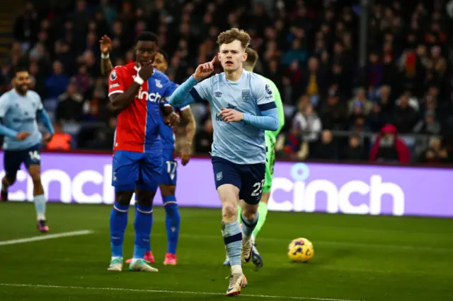 Keane Lewis-Potter celebrates scoring against Crystal Palace