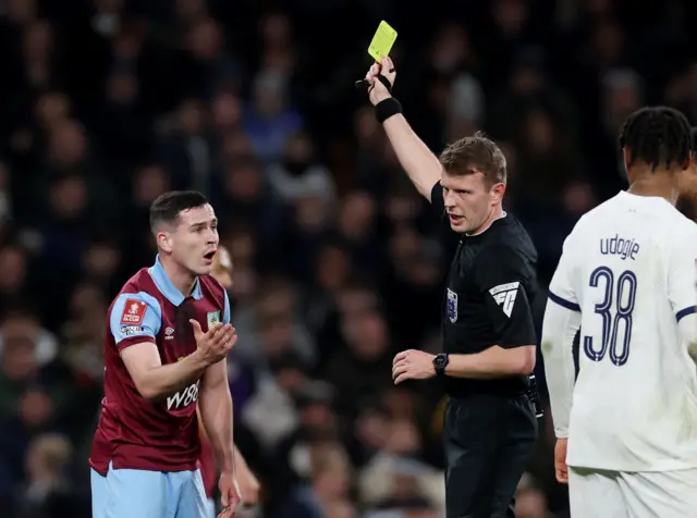 Cullen is shown the first yellow card of the game by the ref.