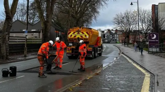 Workmen cleaning the street in Shrewsbury