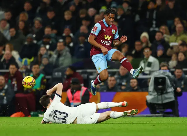 Odobert hurdles a sliding challenge from Davies.