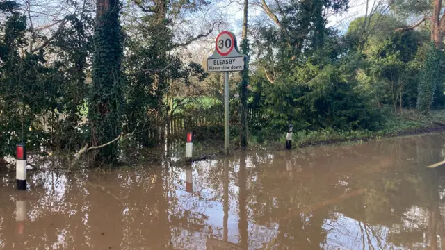 A road flooded in Bleasby village