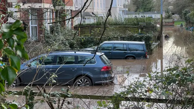 Flooded cars in Gloucestershire