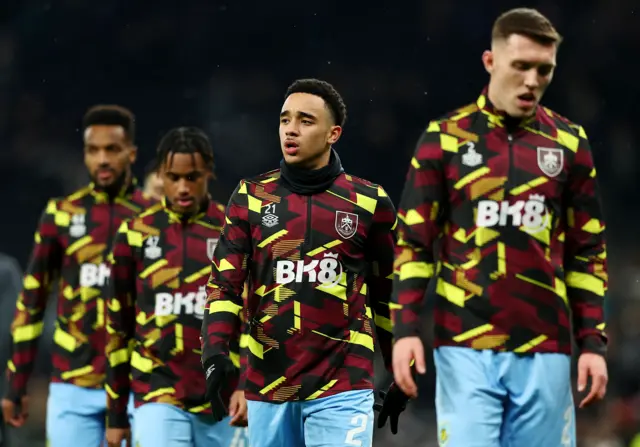 Burnley players warm up ahead of their cup tie at Spurs.