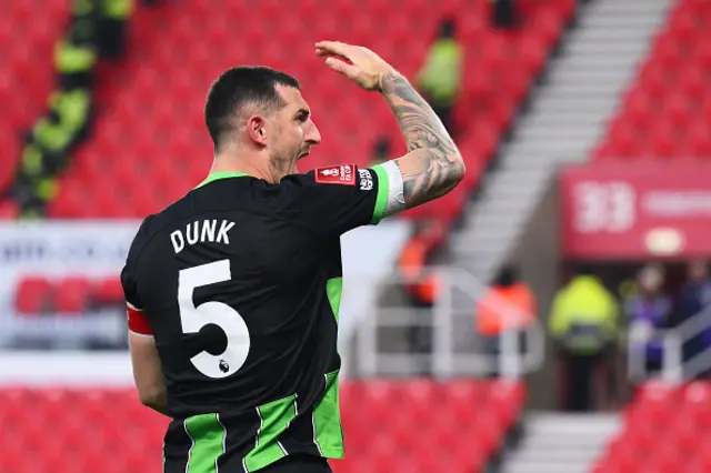 Lewis Dunk celebrates after scoring