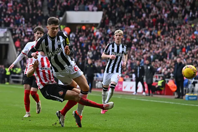 Luke O'Nien tackles Newcastle United's English midfielder Lewis Miley