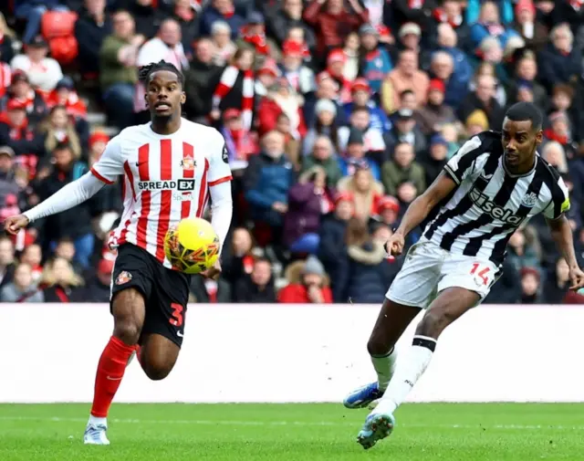 Alexander Isak takes his shot which doubles Newcastle's lead