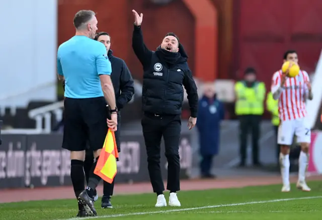 Roberto De Zerbi, Manager of Brighton & Hove Albion, gestures towards assistant referee