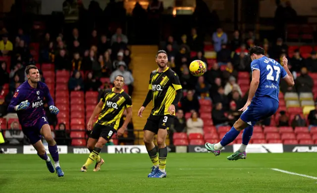 Joe Quigley of Chesterfield heads his attempt towards the goal