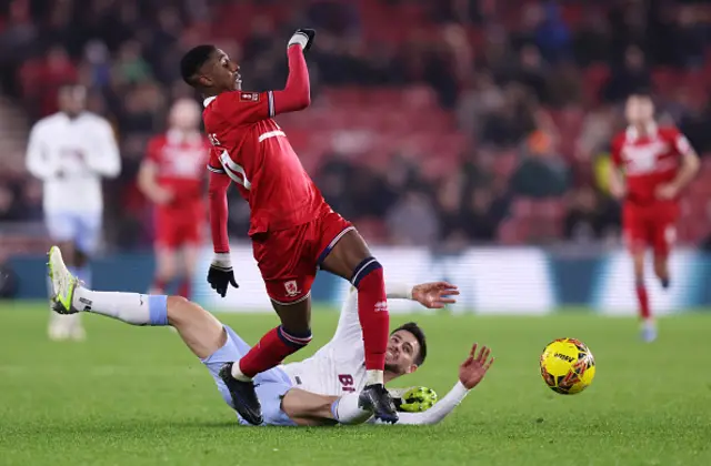 Isaiah Jones of Middlesbrough is challenged by Alex Moreno