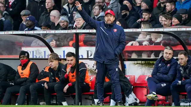 Cheltenham Town boss Kevin Russell in the dug out against Portsmouth