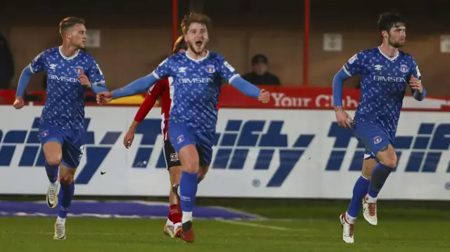 Exeter City players celebrate against Carlisle