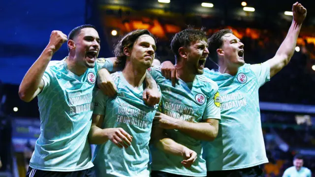 Crawley Town players celebrate in their game against Bradford