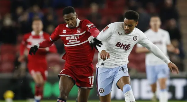 Isaiah Jones battles with Aston Villa's Jacob Ramsey for the ball