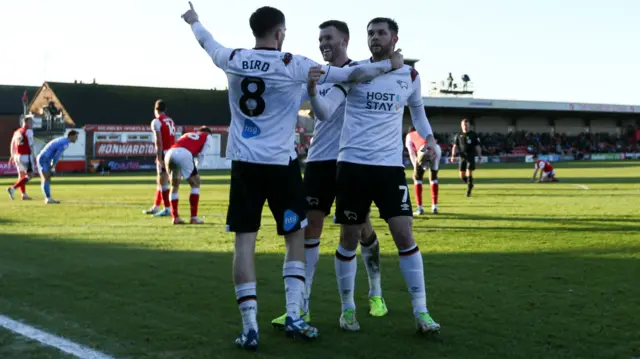 Derby players celebrate their third goal against Fleetwood