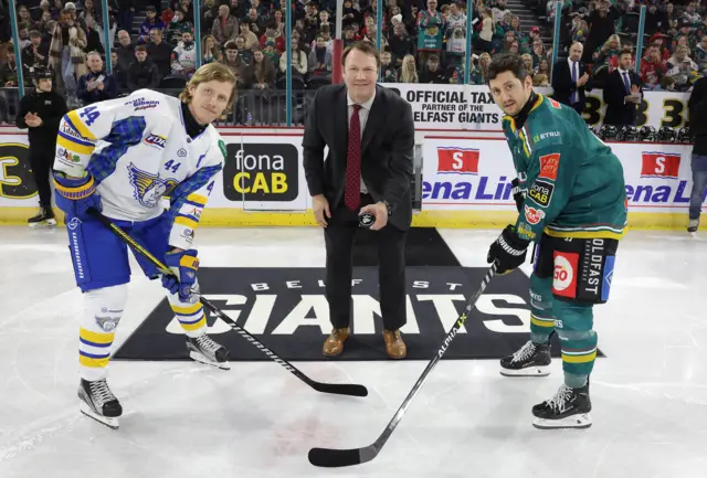 Former Giants coach Doug Christiansen, now ECAC Commissioner, drops the puck