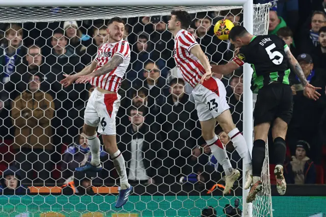 Lewis Dunk heads it in at the back post as two Stoke City players miss defend