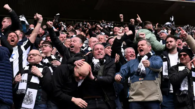 Newcastle fans celebrate a goal against Sunderland in the FA Cup