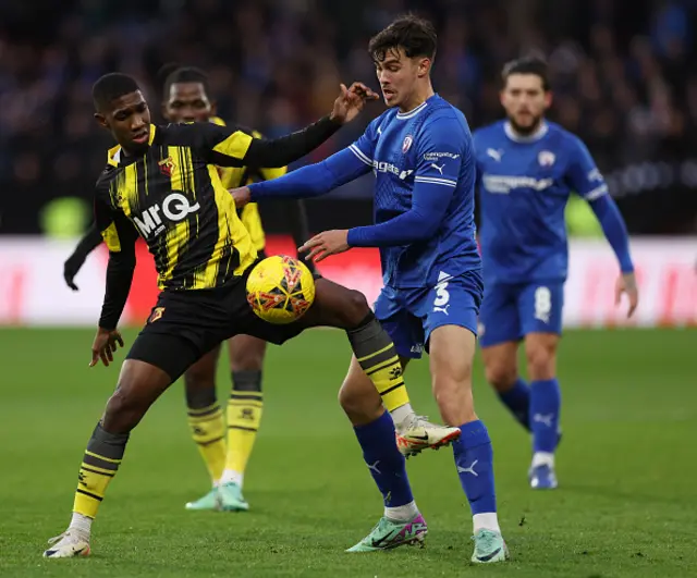 Branden Horton of Chesterfield is challenged by Yaser Asprilla