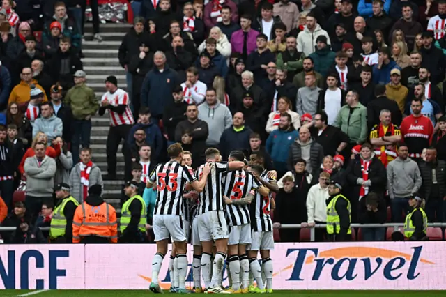 Newcastle players celebrate their first goal