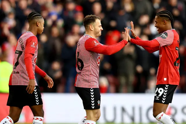 Ryan Fraser of Southampton is congratulated by team mate Jayden Meghoma