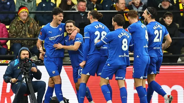 Chesterfield players celebrate their goal in the FA Cup against Watford