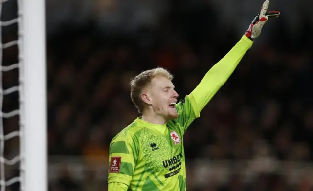 Middlesbrough's Thomas Glover reacts with his left arm aloft