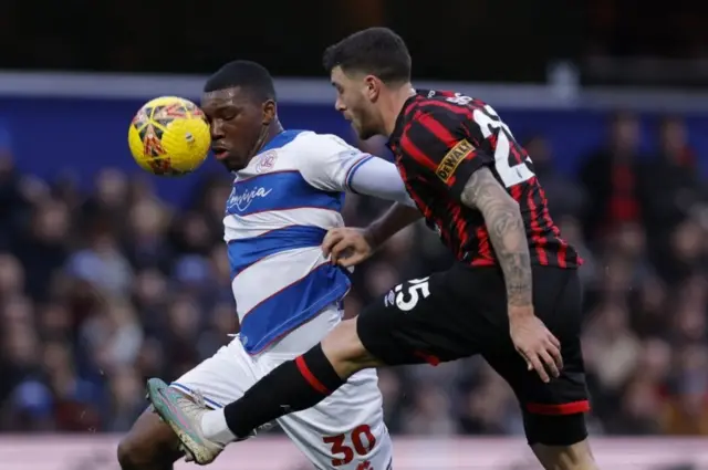 Sinclair Armstrong in action with AFC Bournemouth's Marcos Senesi