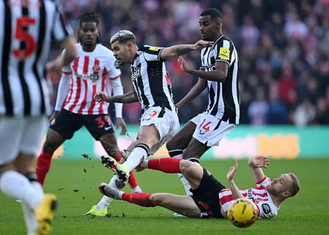 Bruno Guimaraes of Newcastle United is challenged by Alex Pritchard