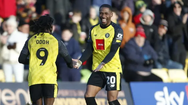 Harrogate celebrate their third goal in their win over Doncaster