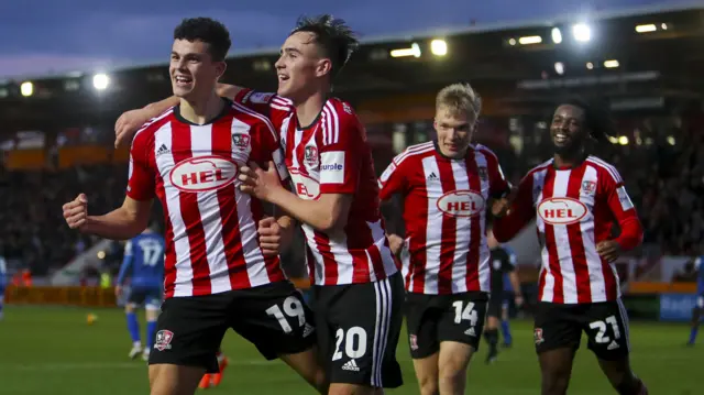 Exeter celebrate a goal against Carlisle