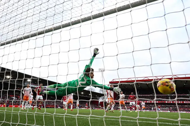 Nottingham Forest's Argentinian midfielder Nicolas Dominguez shoots the ball and scores his team first goal past Blackpool's goalkeeper Daniel Grimshaw