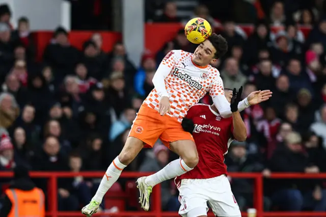 Kyle Joseph heads the ball as he fights for the ball with Murillo